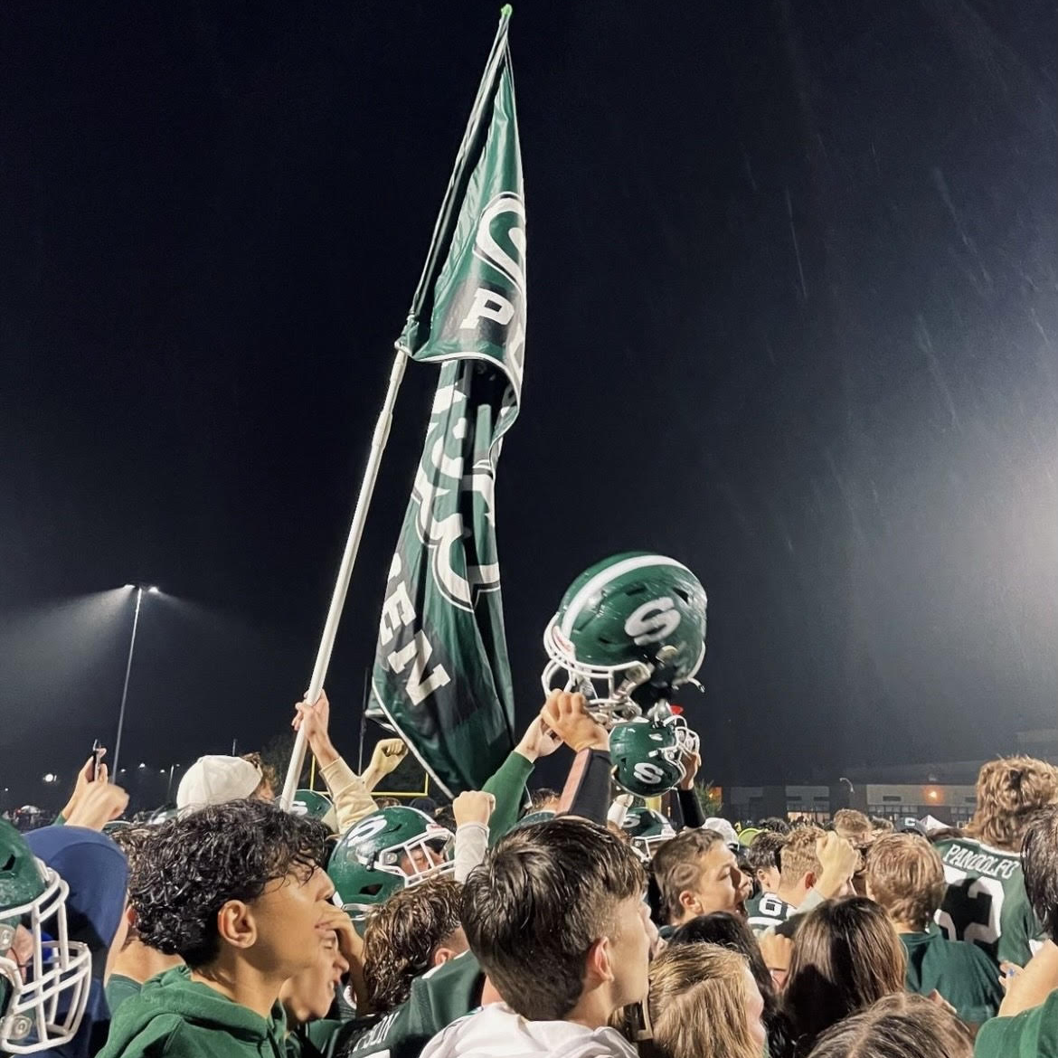 Students stormed the field at Homecoming 2023. 